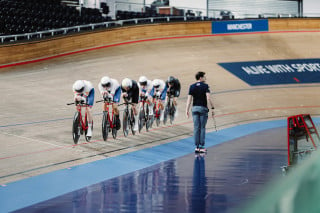 Matt Brammeier coaching a men's team pursuit session on the track