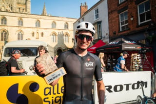 Matt holding his Lincoln GP cobble trophy after winning the event in 2024